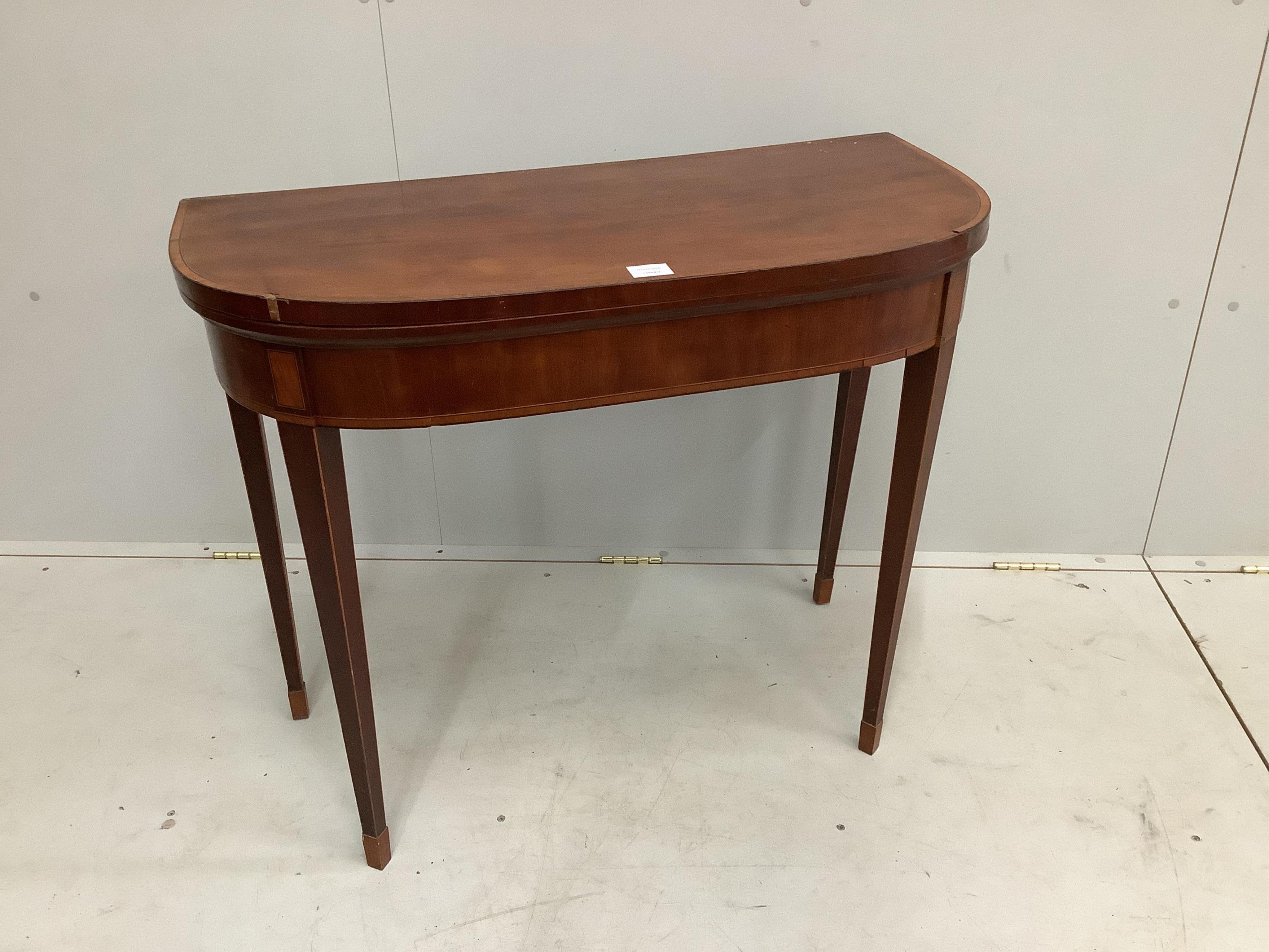 A George III satinwood banded mahogany D shaped folding card table, width 91cm, depth 45cm, height 75cm